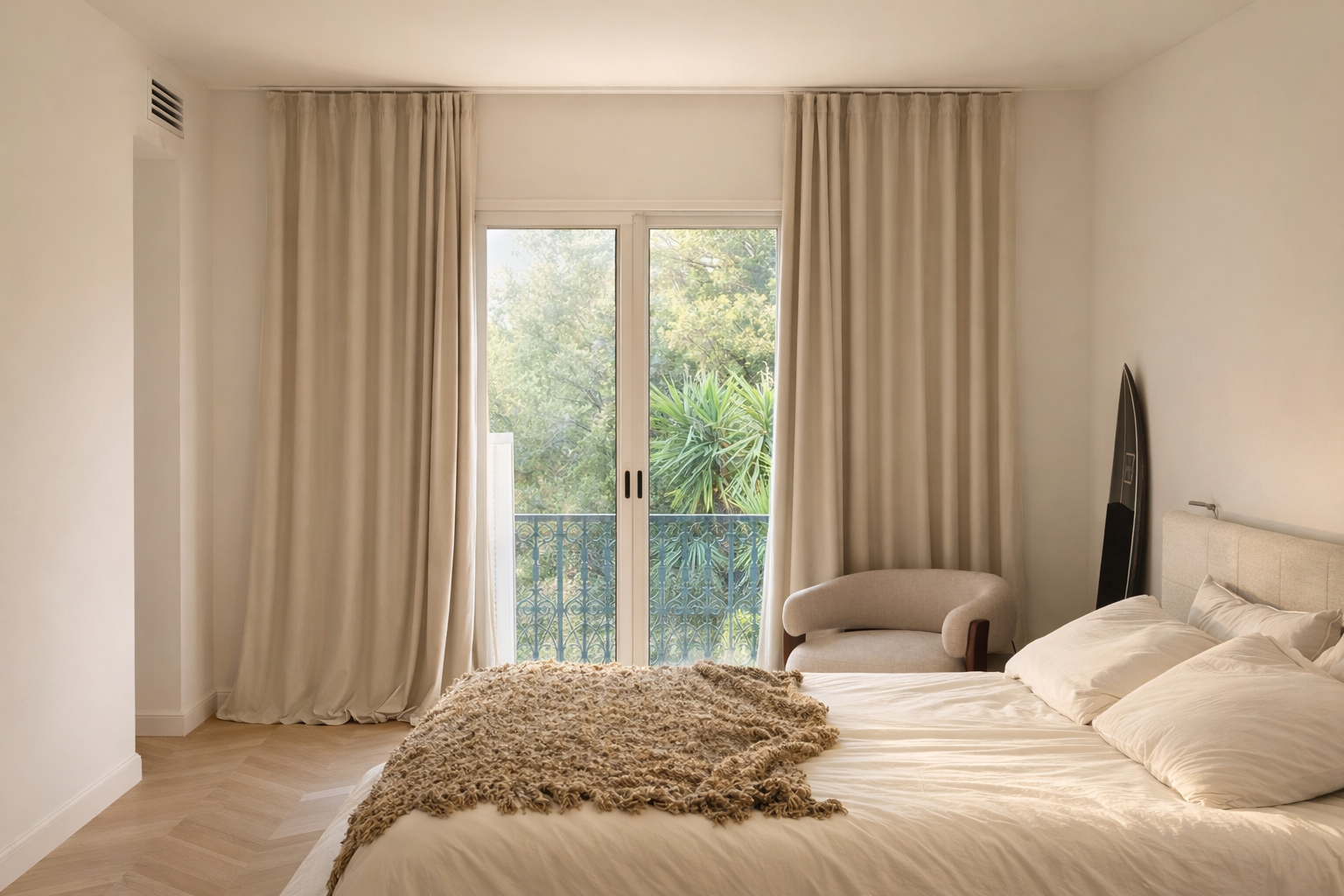Master bedroom with private balcony and park view, soft morning light