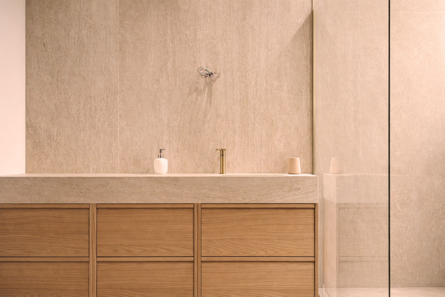 Bathroom vanity with brass taps and integrated storage